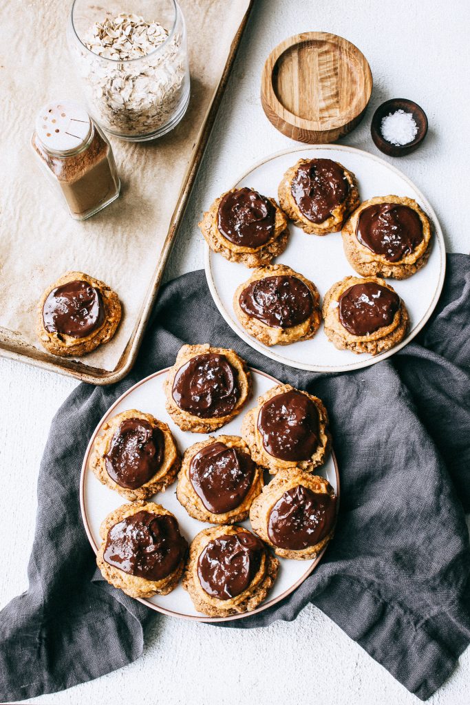 melty chocolate pumpkin cheesecake cookies on white plates