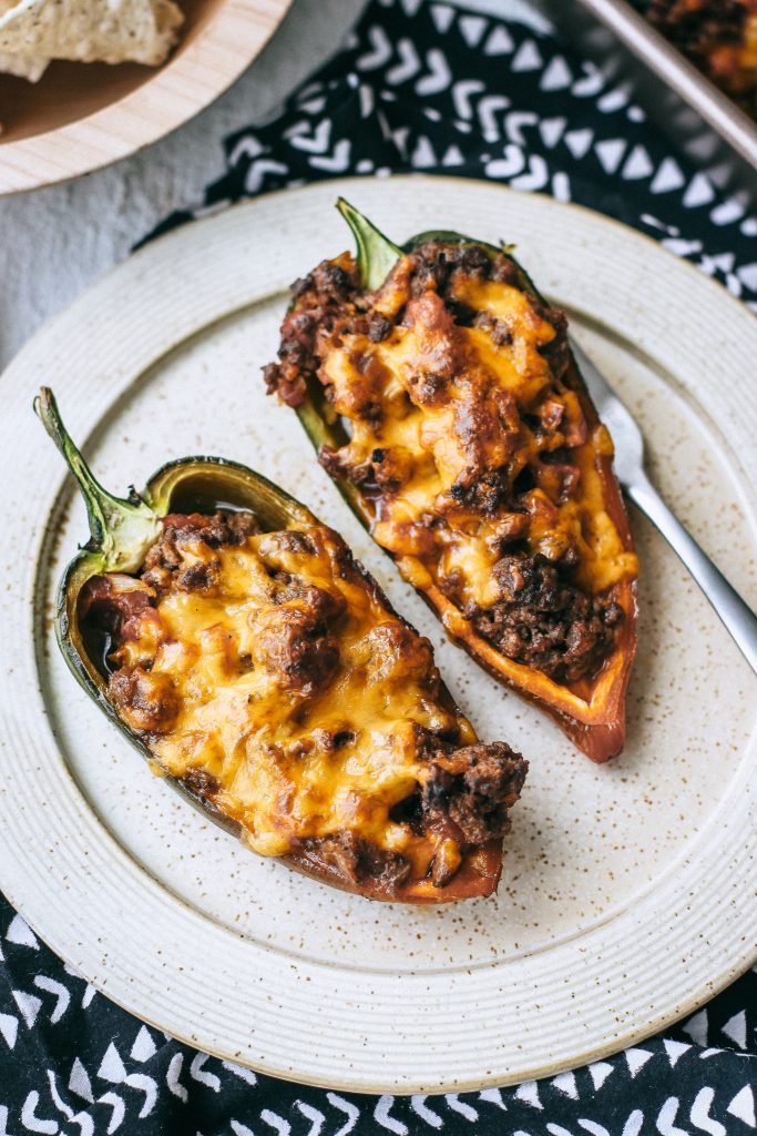 cheesy stuffed peppers on a plate  