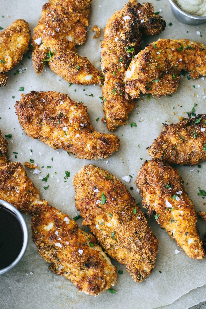 chicken tenders on parchment paper