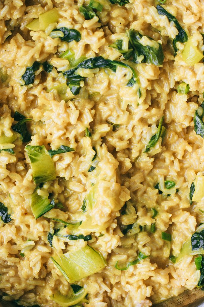 creamy yellow rice with bok choy and spinach 