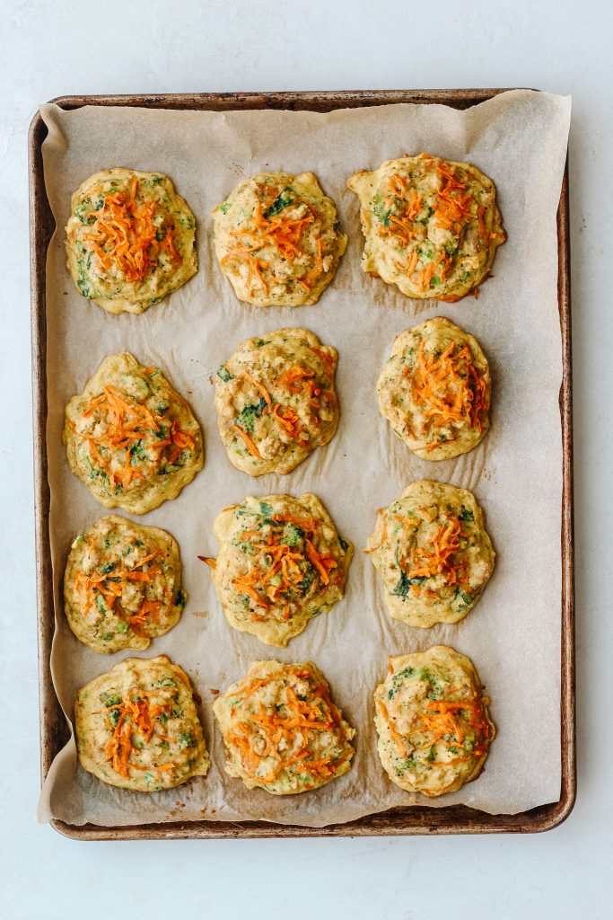 Paleo broccoli and sweet potato breakfast biscuits on a sheet pan.