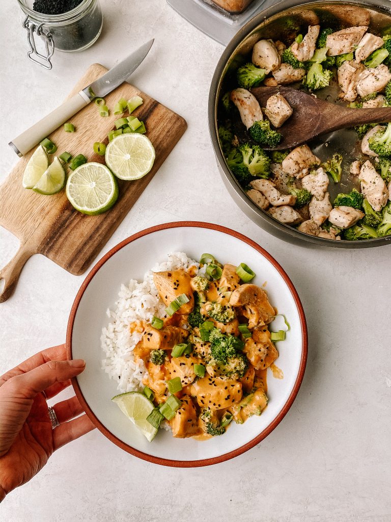 cashew curry chicken and broccoli with rice in a bowl