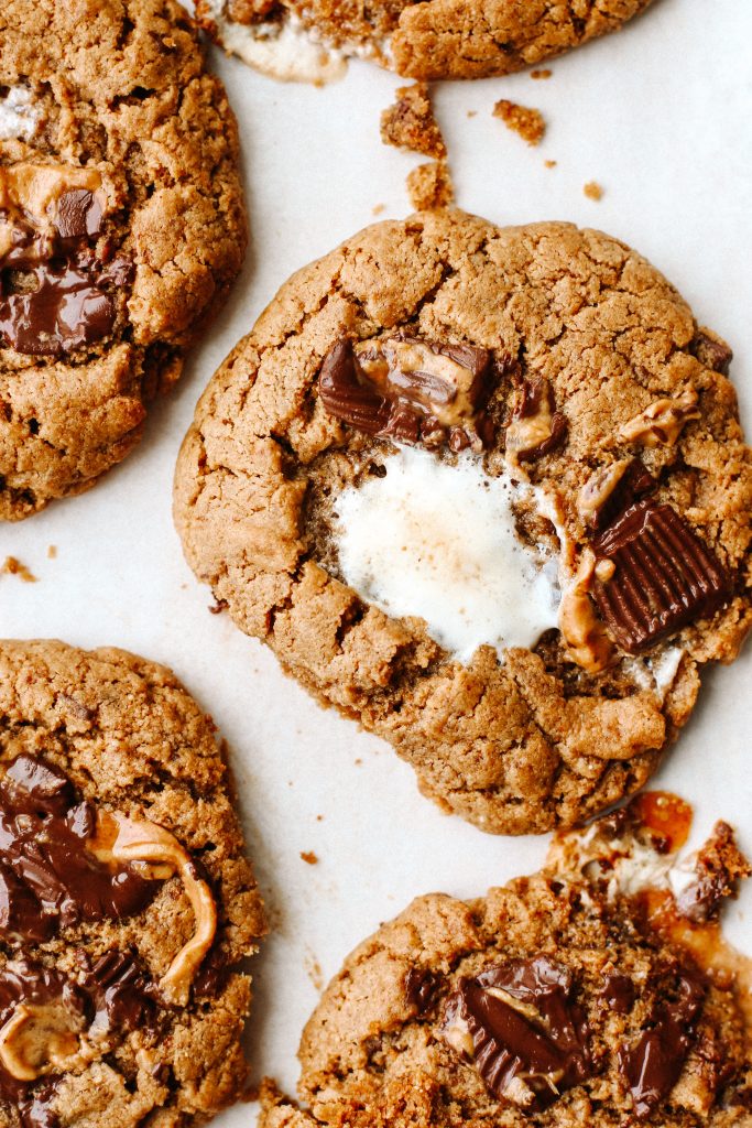 peanut butter cup s'mores cookies on parchment paper