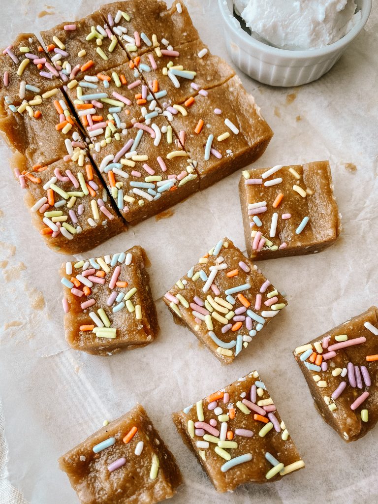 no bake funfetti squares with sprinkles on parchment paper