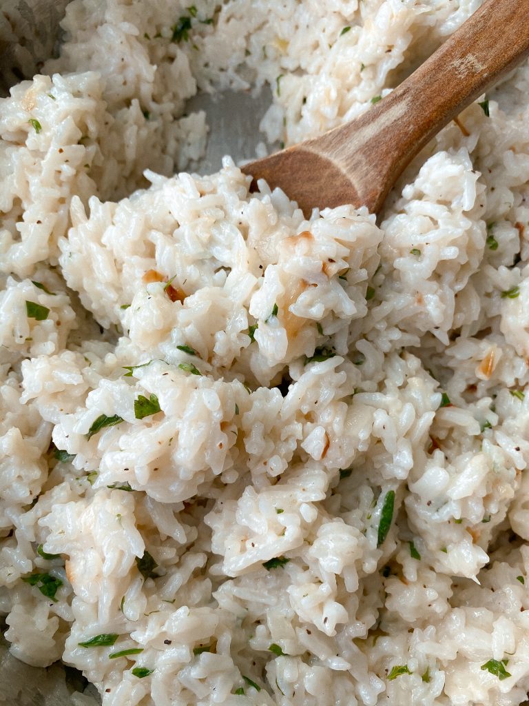 Creamy coconut lime rice with wooden spoon