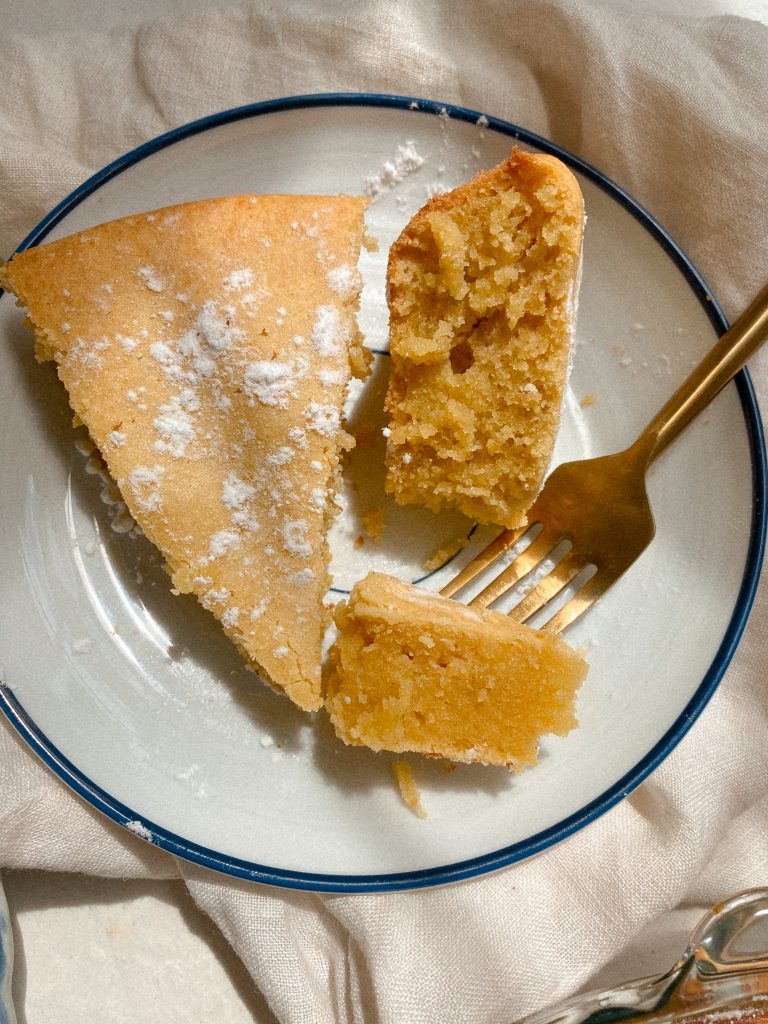 2 slices of lemon cake on plate with gold fork