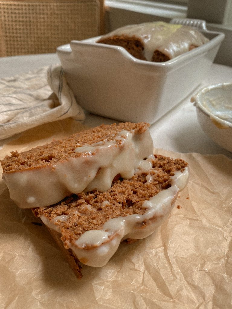 slices of cinnamon bread with cream cheese flaze on parchment paper