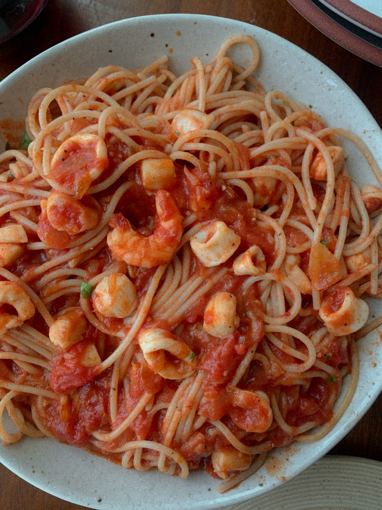 seafood spaghetti in a white bowl