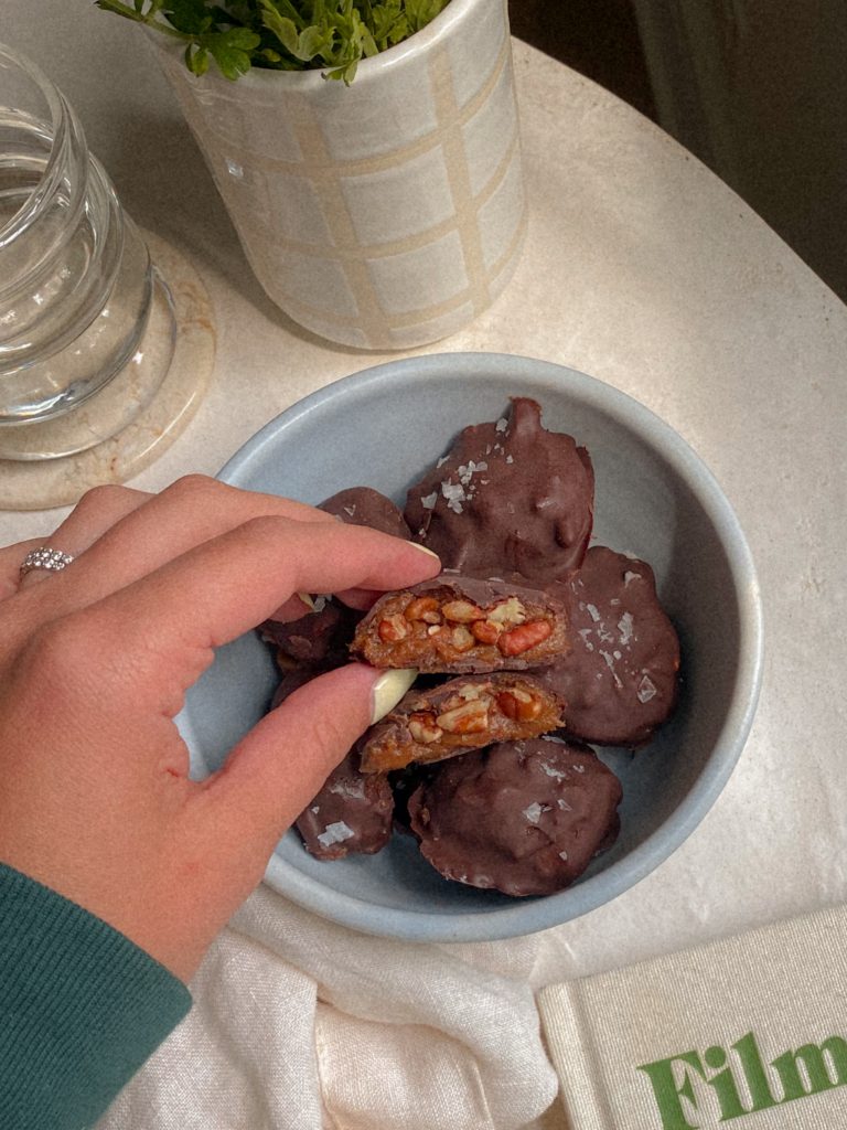 vegan frozen chocolate turtles in a bowl with chunky sea salt 